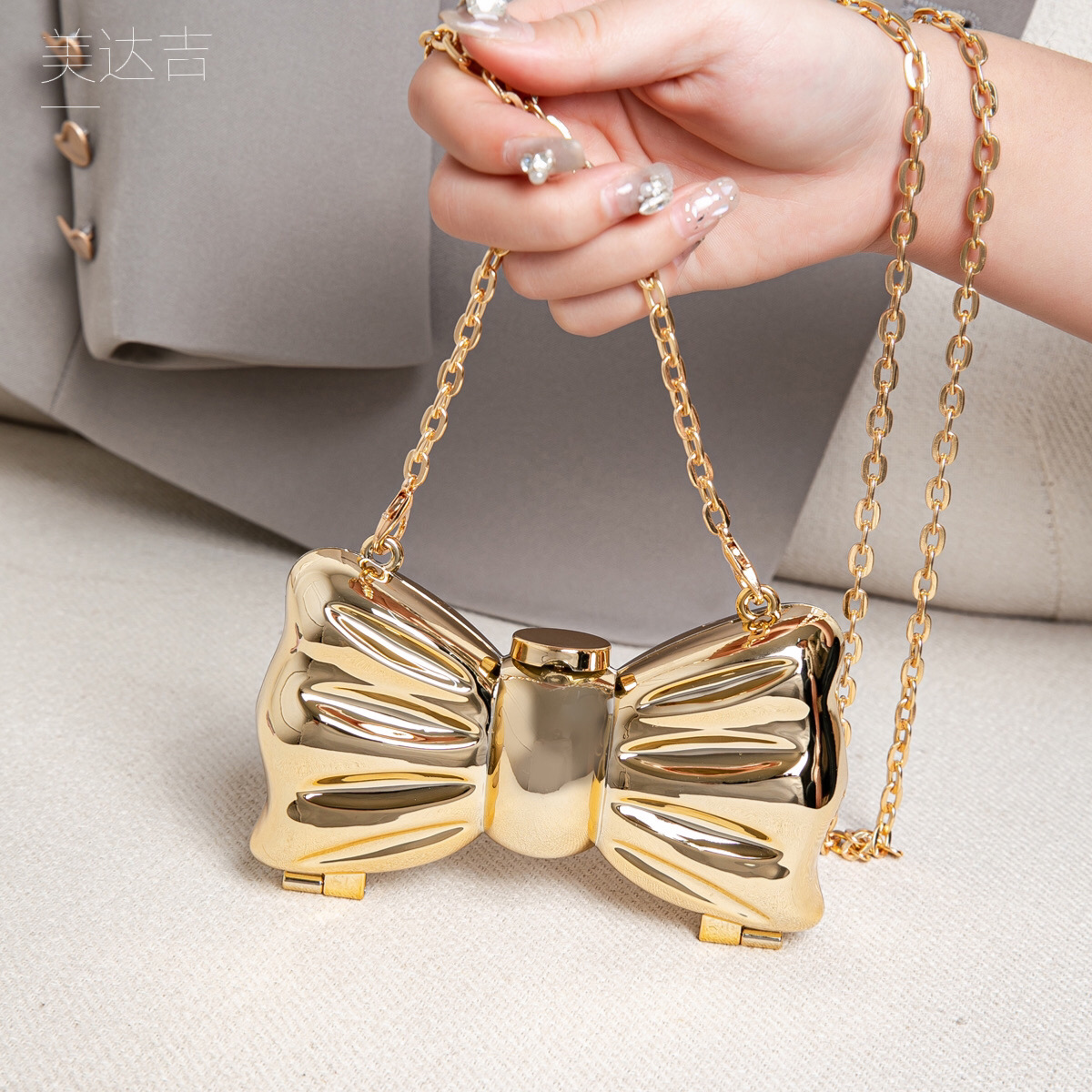 Glanzende gouden metalen strik - Luxury Bags Cute recensie en prijs