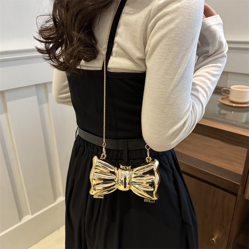 Glanzende gouden metalen strik - Luxury Bags Cute recensie en prijs